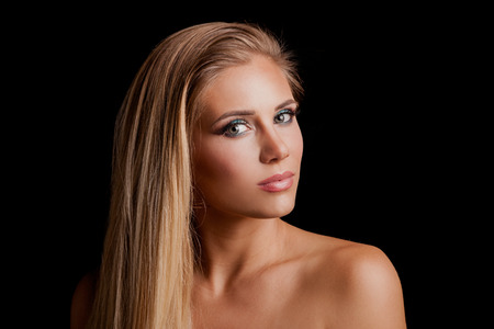 beautiful young blonde green eyes woman with long straith healthy hair  studio shotの写真素材