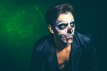 scary halloween skeleton man in jacket studio shotの写真素材