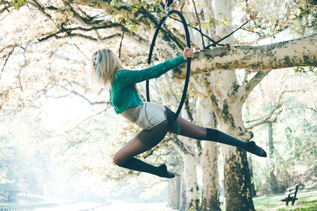 young woman aerial hoop  dance in forestの写真素材