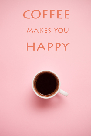 cup of black coffee on pink  background with quotes  の写真素材