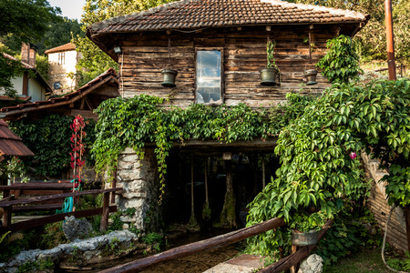 old water mill in mountain village summer sunny dayの写真素材