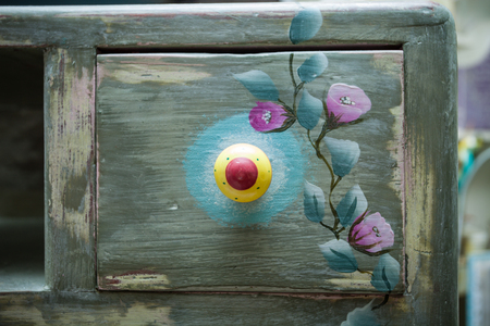 drawer of wooden dresser painted and decorated diy closeupの写真素材