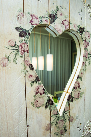 diy heart-shaped wooden frame mirror decorated and painted  indoor の写真素材