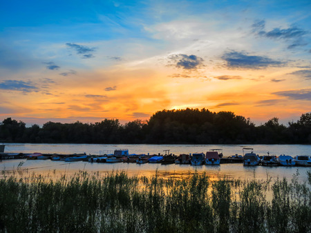 Beautiful sunset over a riverの写真素材