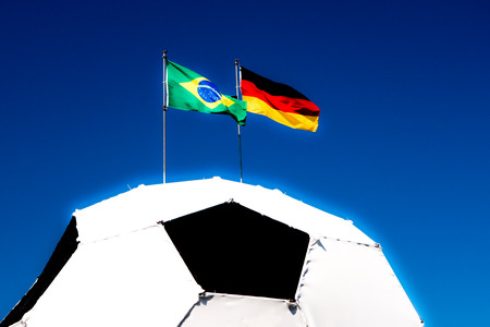 German and Brazilian flag on footballの写真素材