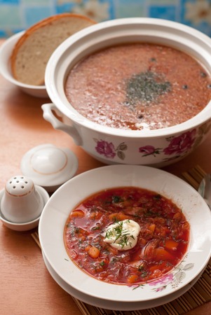 Borsch -traditional russian soup with red beets on the wooden backgroundの写真素材
