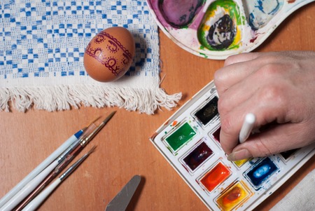 Preparation for Easter, painting eggs with paintsの写真素材