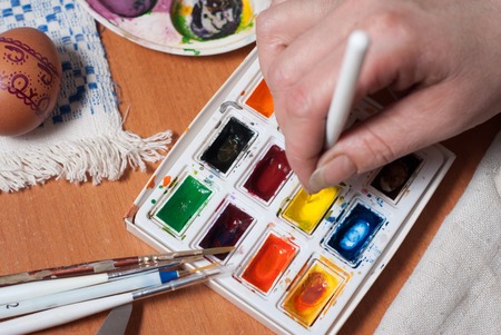 Preparation for Easter, painting eggs with paintsの写真素材