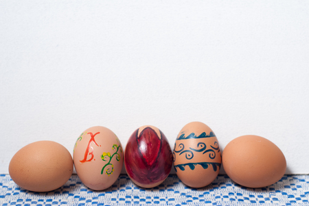Colorful eggs on blue white towel. Easter backgroundの写真素材