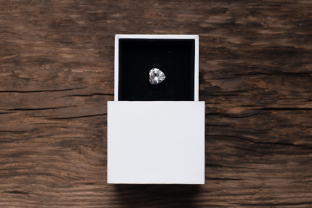 Diamond Ring in Box, old Wood backgroundの写真素材