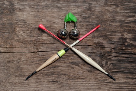 Fishing floats assorted colors. On wooden backgroundの写真素材