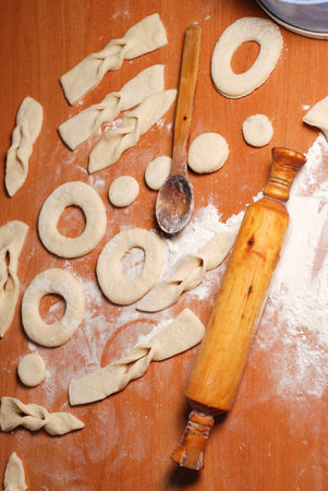The pastry chef prepares the donuts from dough, top viewの写真素材