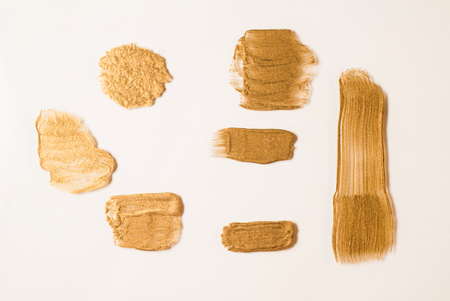 the set of Strokes of Golden yellow paint on a white backgroundの写真素材