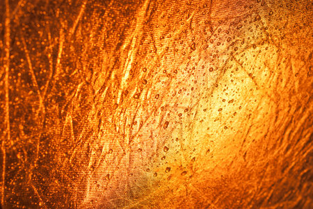Large drops of water on a yellow orange background