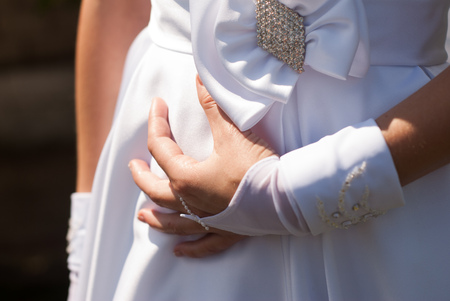 the bride's hand in a white gloveの写真素材
