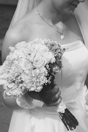 bride in white dress with bouquet aの写真素材