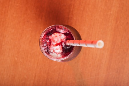 pink cocktail with red plum and yoghurt, strips with starsの写真素材