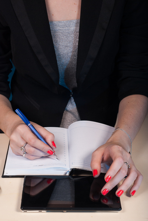 woman in business clothes writes in the notebook, concept business girl, Deskの写真素材