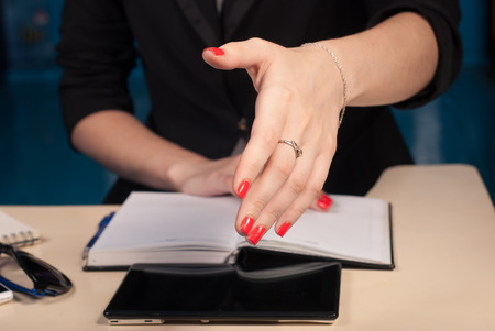 business woman stretches out hand for a handshake, close-up,の写真素材