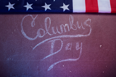 The text on the Board and an American flag, happy Columbus Dayの写真素材