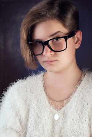 young girl with glasses, girl teenager with short hairの写真素材