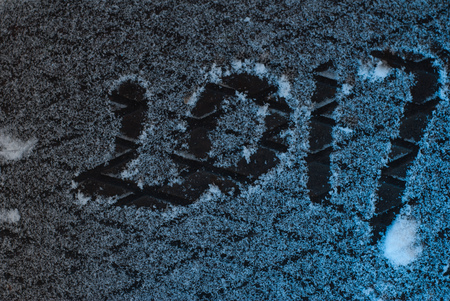 2017 new year's greetings, footprints in the snow, New year 2017, the numbers on the snowの写真素材