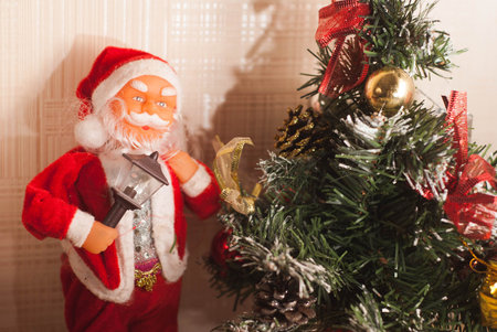 Toy Santa Claus and Christmas tree, merry Christmas and happy new year
