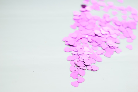 Colorful confetti on light background, little hearts rise up, bokeh, Valentine dayの写真素材