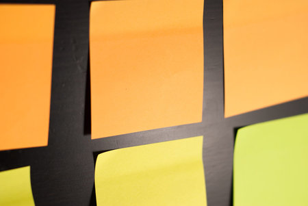 reminder sticky note on black background, office adhesive stickers