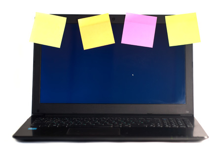 Laptop with reminders, isolated on white background, office, laptop plastered with colorful remindersの写真素材