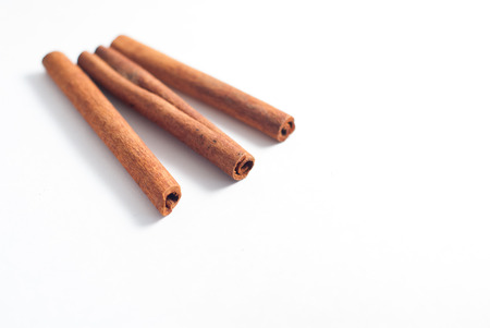 Cinnamon sticks on white background. The view from the topの写真素材