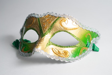 yellow and green Venetian mask on white background, concept of carnival, Gras Mardiの写真素材