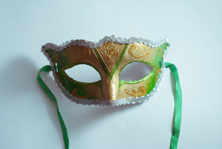 yellow and green Venetian mask on white background, concept of carnival, Gras Mardiの写真素材
