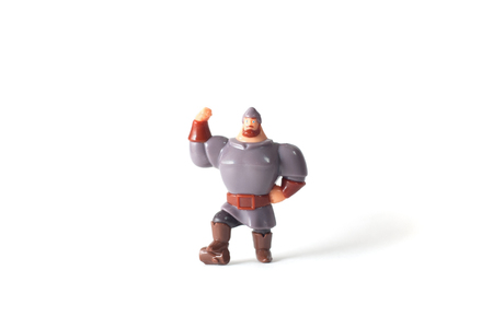 Toy plastic man, a hero on a white backgroundの写真素材