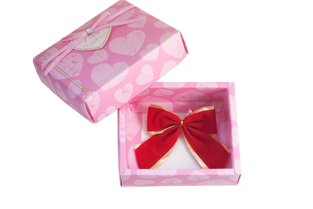 Pink box isolated on white background, gift for women, women's day, with red bow gift boxの写真素材