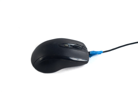 old computer mouse, isolated on a white background, the peripheral device for a computer, the cable is rewound blue tapeの写真素材