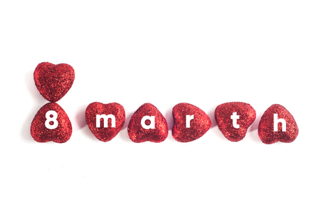 Decorative red heart isolated on a white background, the inscription of hearts, March 8の写真素材