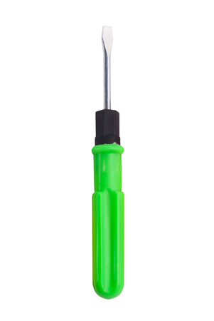 Medium flat screwdriver with green handle isolated on white background, work toolの写真素材