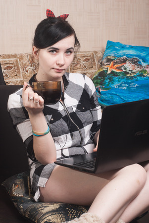 Female blogger. woman typing on laptop sitting on the floor, lifestyle vlogの写真素材