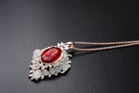 Pendant with a red ruby, Smyrna jewelry, jewelry, precious faceted stone on chainの写真素材