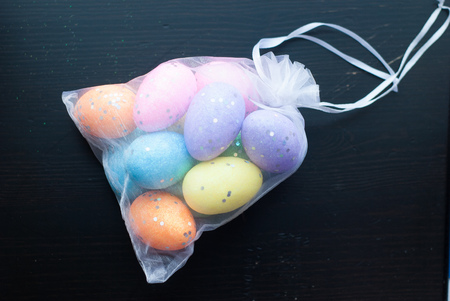 Decorative eggs in transparent bag. Eggs for celebrating Easter. Eggs of different colors, happy Easterの写真素材