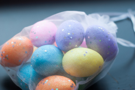 Decorative eggs in transparent bag. Eggs for celebrating Easter. Eggs of different colors, happy Easterの写真素材