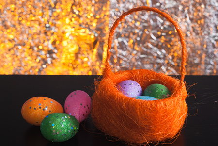 Decorative Easter eggs in a basket, Traditional decoration, happy Easter, layout for postcardの写真素材