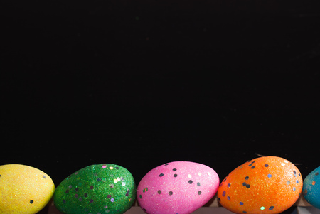 Easter eggs on black background, frame of eggsの写真素材