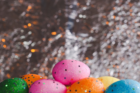 Colorful Easter eggs on foil background, festive background, happy Easterの写真素材