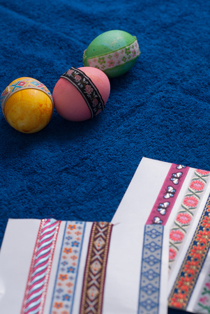 Colorful Easter egg on the blue background and copyspace, happy Easter, labels with patternsの写真素材