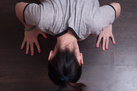 A young girl is pushed from the floor, the concept of fitness, sports clothing,の写真素材