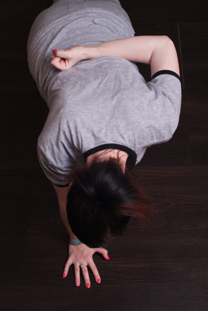 A young girl is pushed from the floor, the concept of fitness, sports clothing,の写真素材