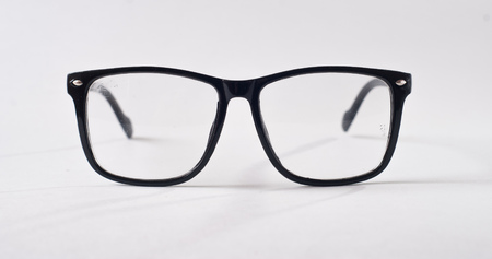 Black glasses on a white background, hipster style, plastic frames, the concept of poor visionの写真素材