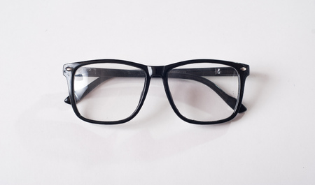 Black glasses on a white background, hipster style, plastic frames, the concept of poor visionの写真素材